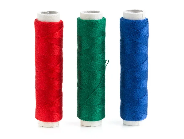 Red, green and blue sewing yarn rolls — Stock Photo, Image