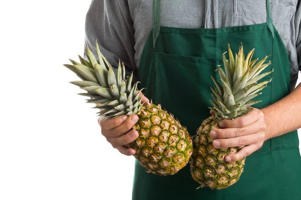 Farmer holding whole fresh pineapple fruit — Stock Photo, Image