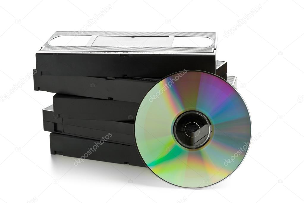 Stack of analog video cassettes with DVD disc