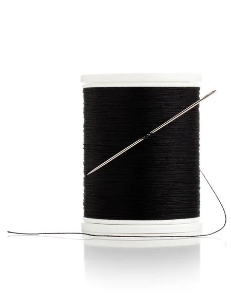 Sewing needle and thread spool macro — Stock Photo, Image