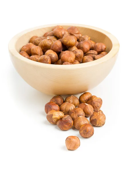 Cracked and shelled hazelnut in wooden bowl — Stock Photo, Image