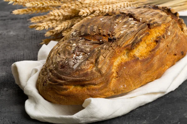 Hand made bread loaf with wheat ears — Stock Photo, Image