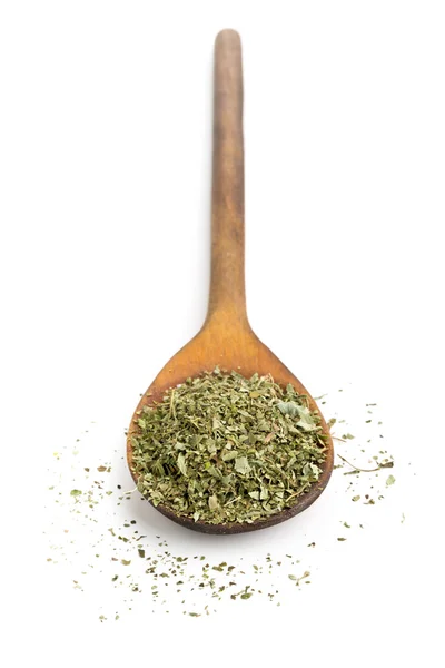 Dried oregano on wooden spoon — Stock Photo, Image