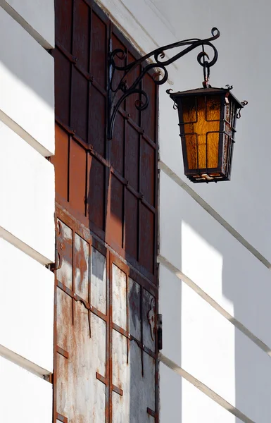 Stone wall with lantern on it — Stock Photo, Image