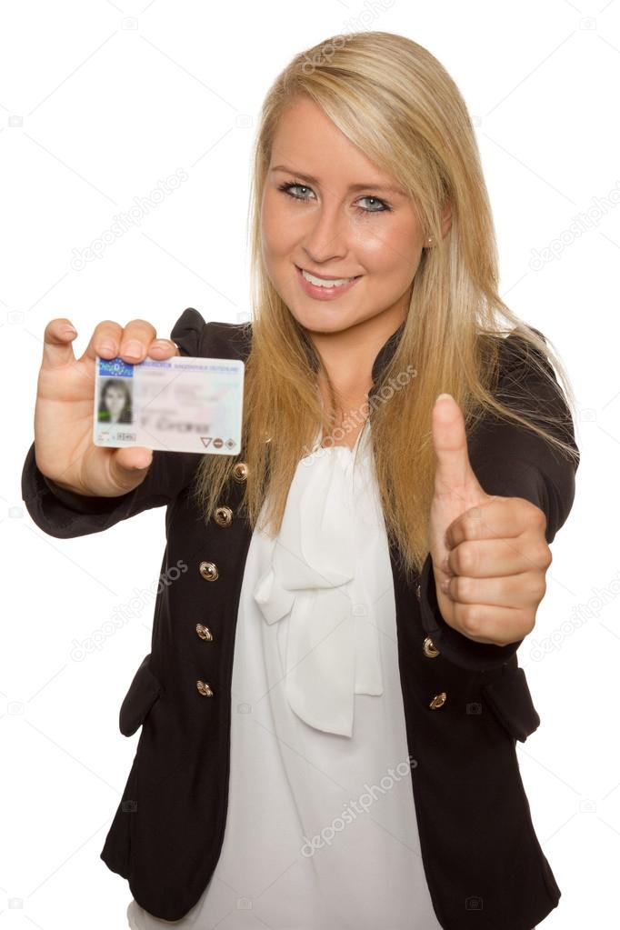 Young woman showing her driver's license