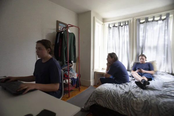 Teenage Boy Room Gaming Using His Phone Stock Photo