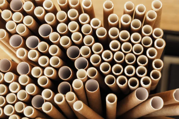 abstract paper tubes of various sizes standing vertically