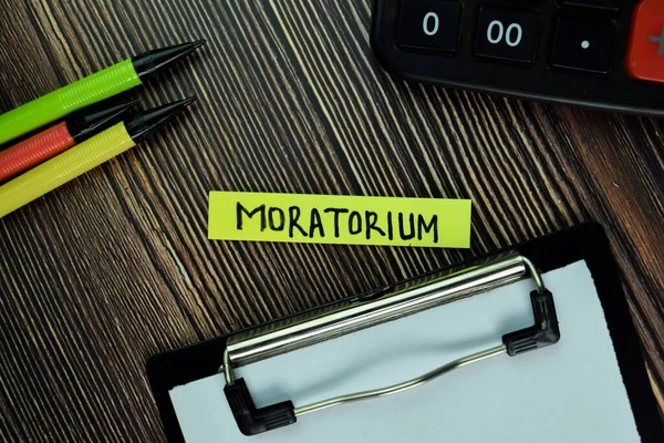 Moratorium Write Sticky Note Isolated Wooden Table Finance Concept — Stock Photo, Image