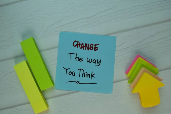Change The Way You Think write on sticky notek isolated on Wooden Table. Selective focus on Change The Way You Think text