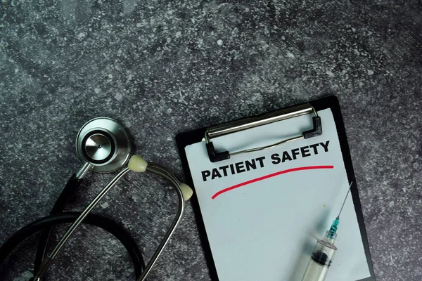 Patient Safety write on a paperwork on the table. Medical or Healthcare concept