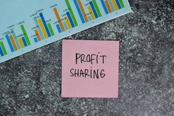 Profit Sharing write on sticky notes on the table. Finance or Business concept