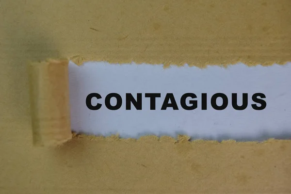Contagious Text written in torn paper