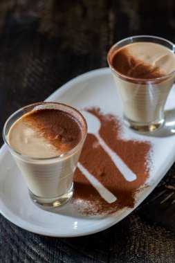 coffee ricotta, spoon dessert in glass cup served in a white plate