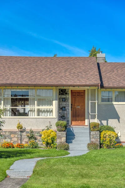 Concrete pathway to the entrance of residential house