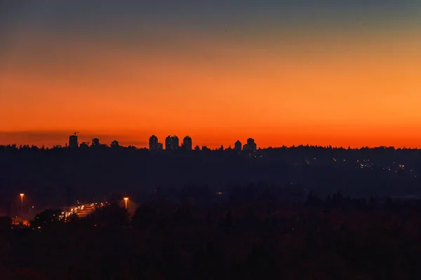 Urban cityscape silhouette on sunset sky background — Stock Photo, Image