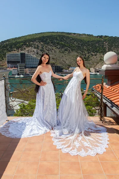 Two brides standing on terrace — Stock Photo, Image