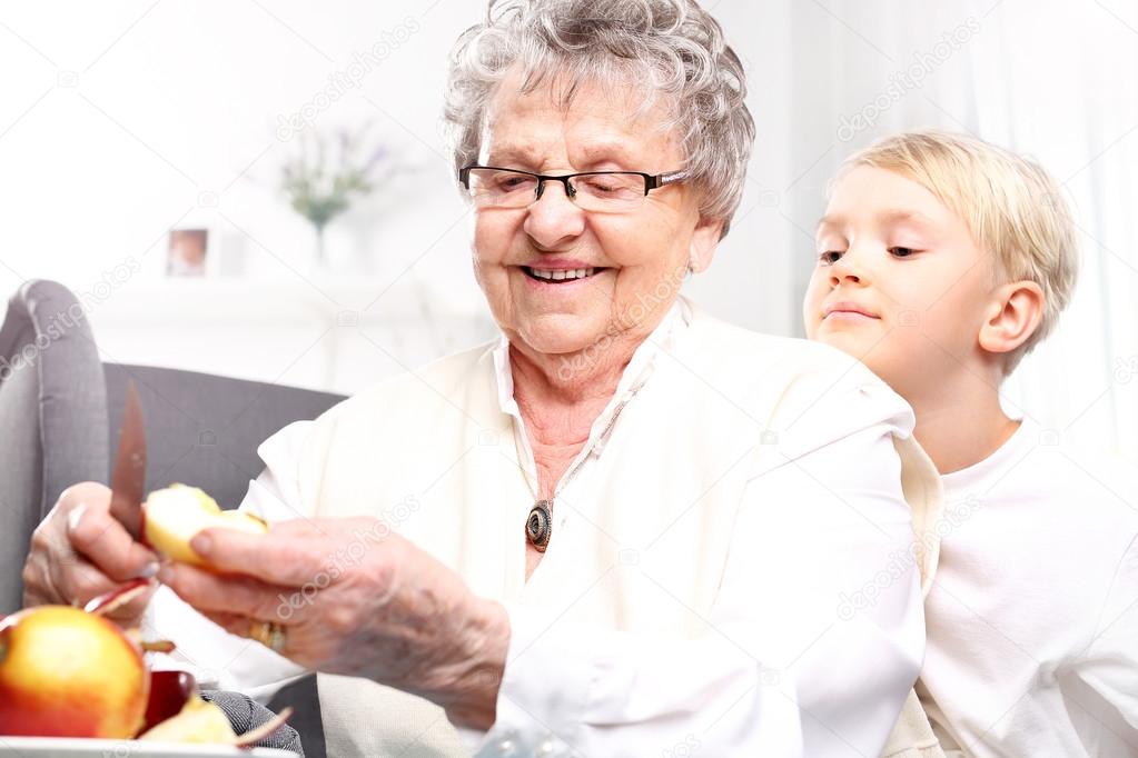 Grandmother looks after the child.