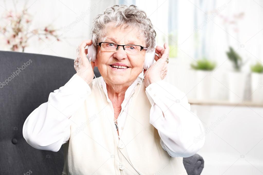  moment of relaxation, rest grandmother listening to music.