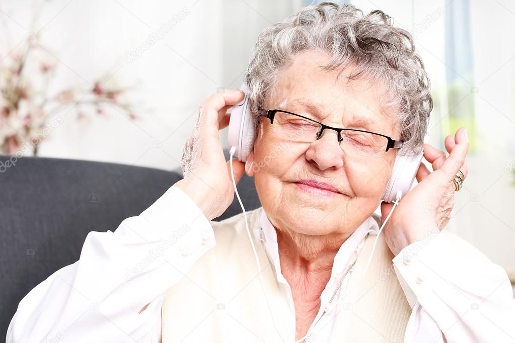 Grandma listens to music.