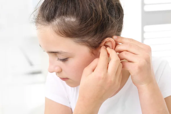 Child with a hearing aid. — Stock Photo, Image