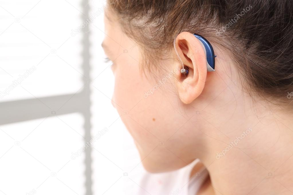 child with a hearing aid.