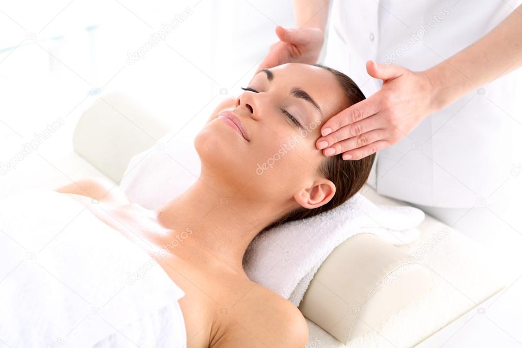 Beauty salon, the woman at face massage