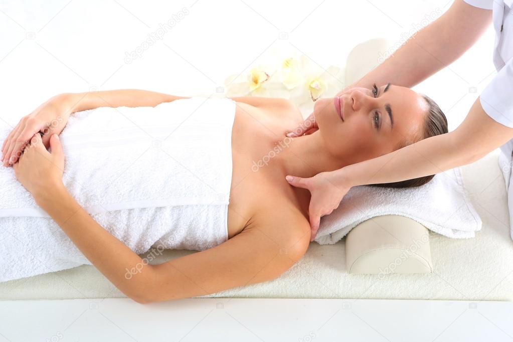 Masseur massaging a woman in a spa