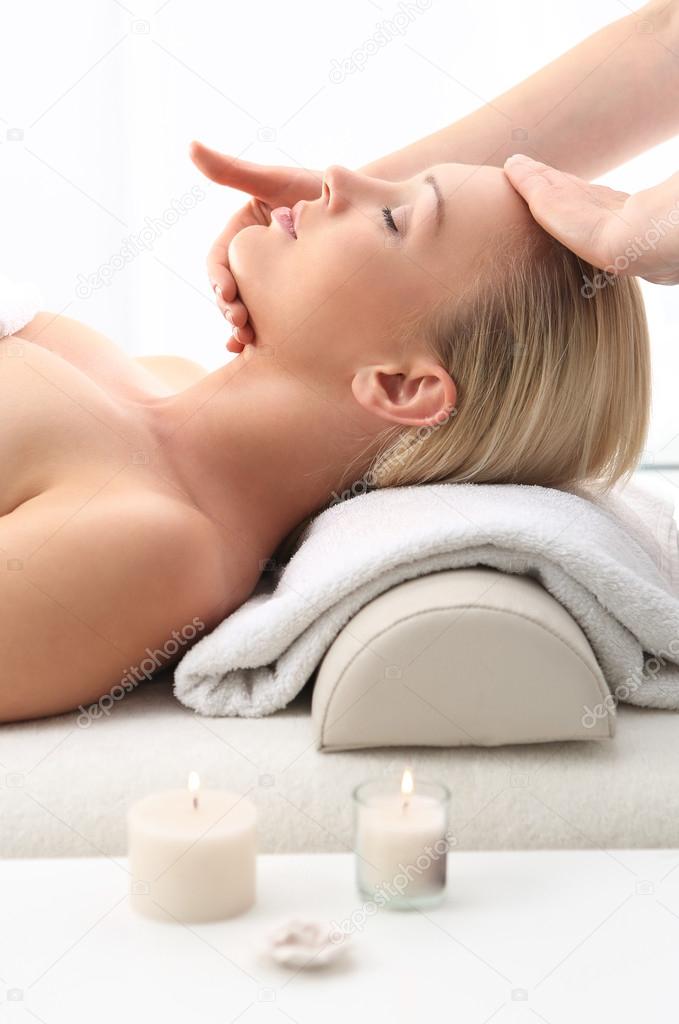 Beauty salon, the woman at face massage