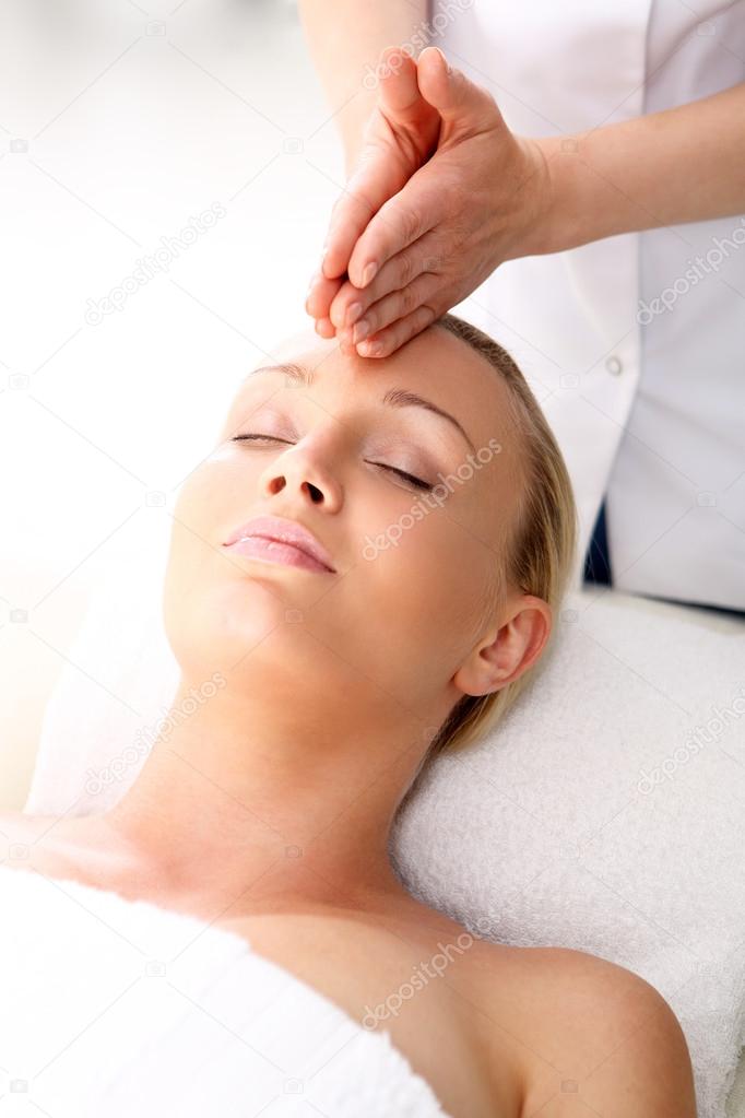 Massage on the third eye, brow chakra