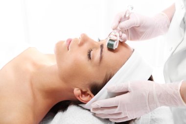 Mesotherapy microneedle, the woman at the beautician clipart