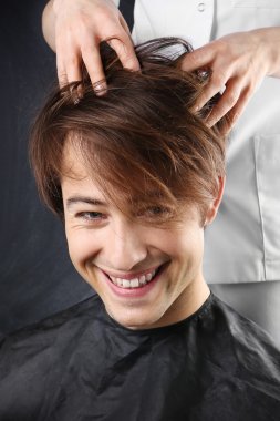 Man at the hairdresser clipart
