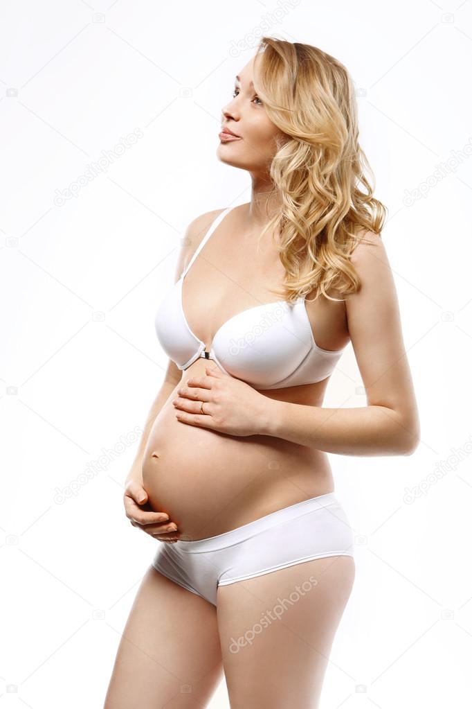Pregnant woman in underwear Stock Photo by ©robertprzybysz 61911697