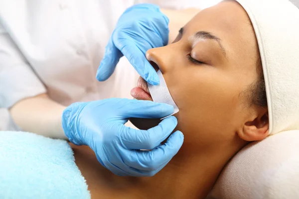 Depilation with hot wax mustache in the beauty salon — Stock Photo, Image