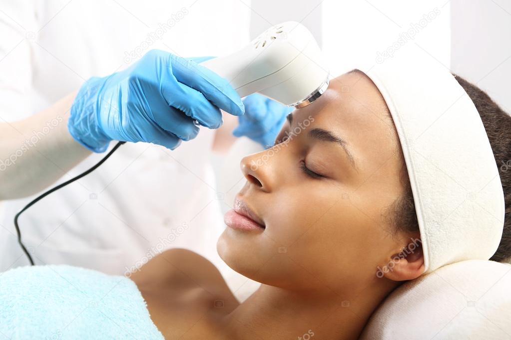 The woman's face during a facial at a beauty salon