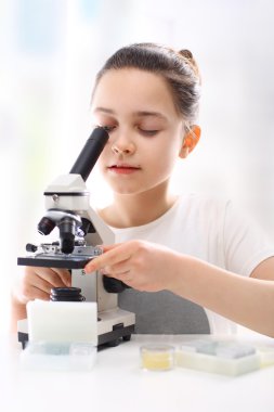 Ecology, nature, wildlife, the girl with a microscope clipart