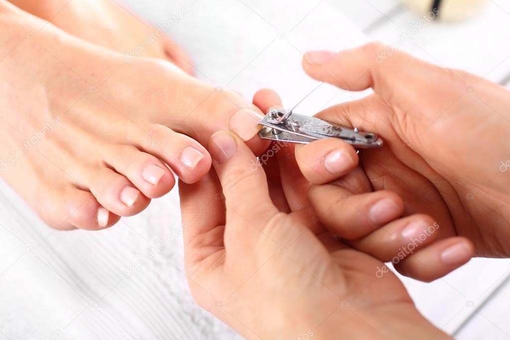 Nail clipping, cutting skins pedicure treatment