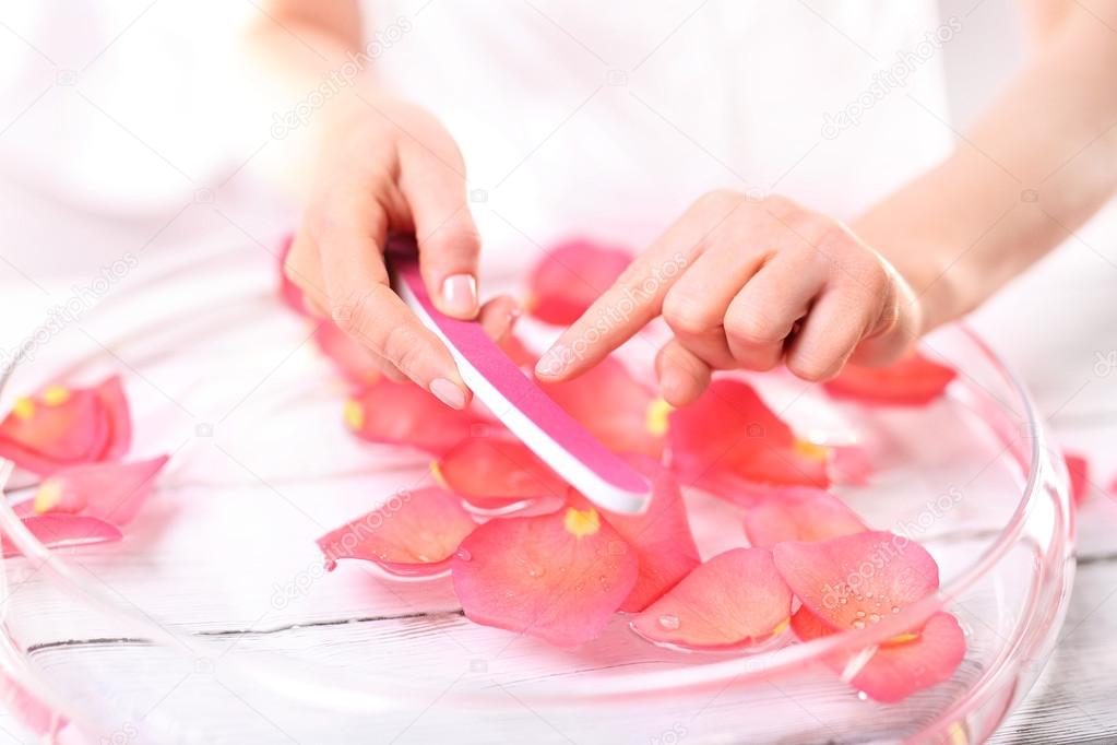 Manicure, nails woman saws