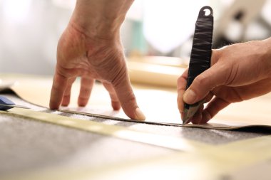 Hands notch tailor fabric.