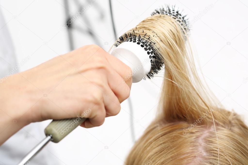 Drying hair on a round brush