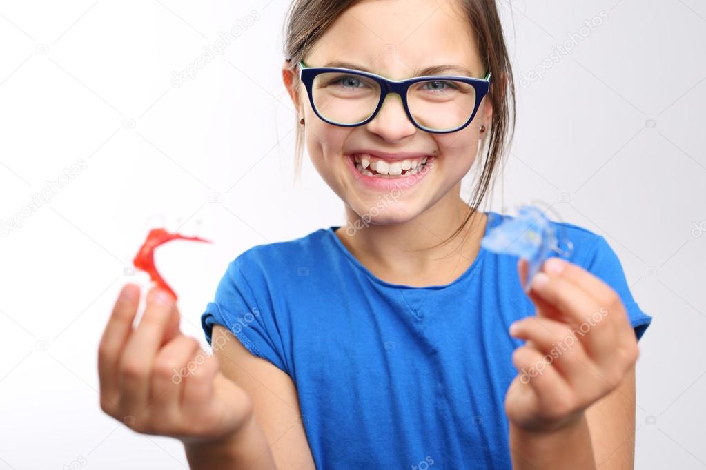 Child with orthodontic appliance.