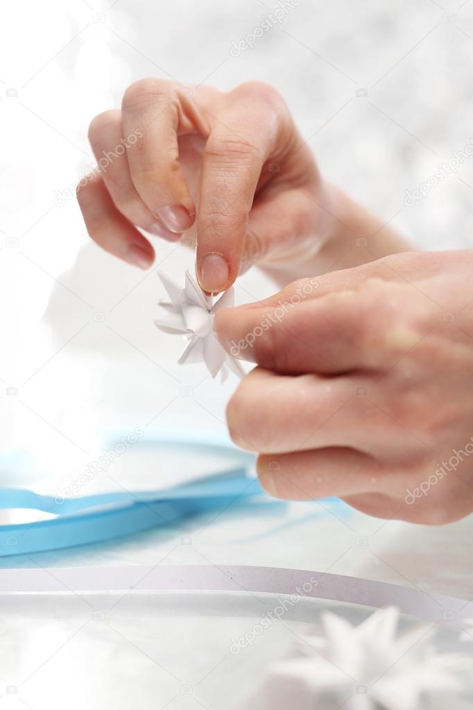 Folding paper star on a Christmas tree