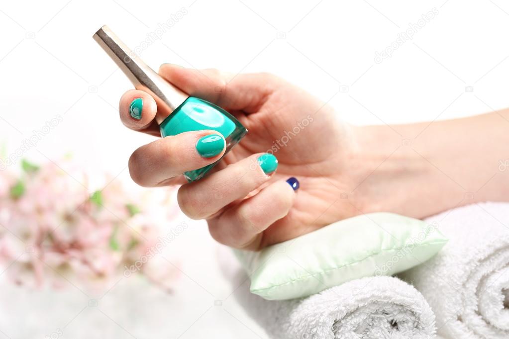 Well-groomed female hands, a colorful manicure