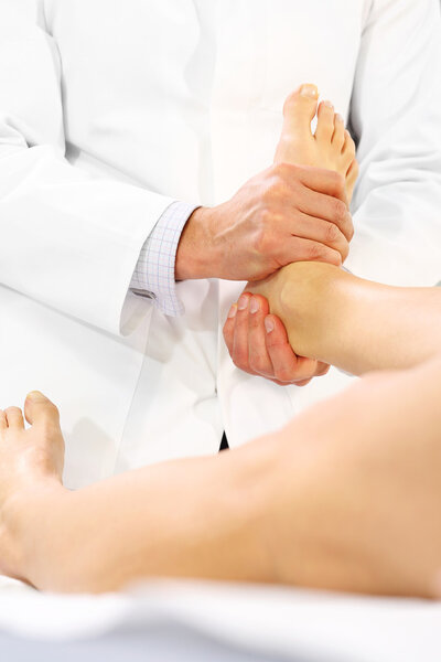 Rehabilitation feet. Rehabilitation. The doctor orthopedist