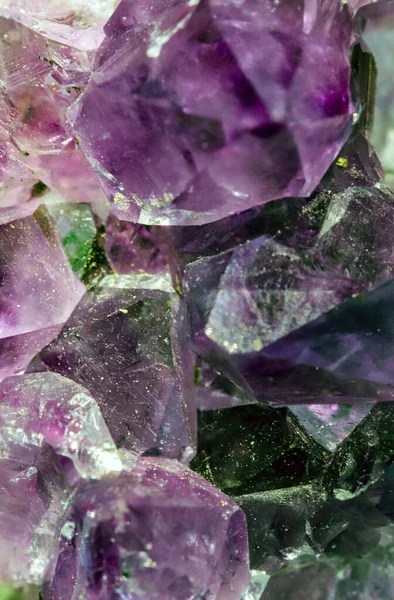 Beautiful crystal magic amethyst gem stone. Texture of specimen with scattered natural light effect.