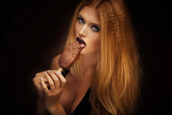 Sexy woman licking chocolate ice cream. — Stock Photo, Image