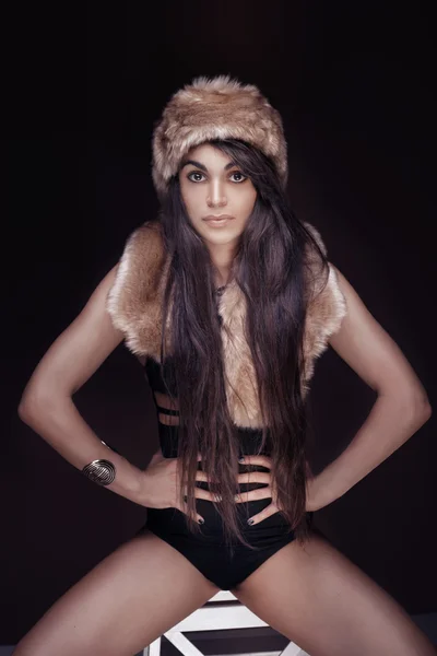 Fashionable girl in fur cap. — Stock Photo, Image