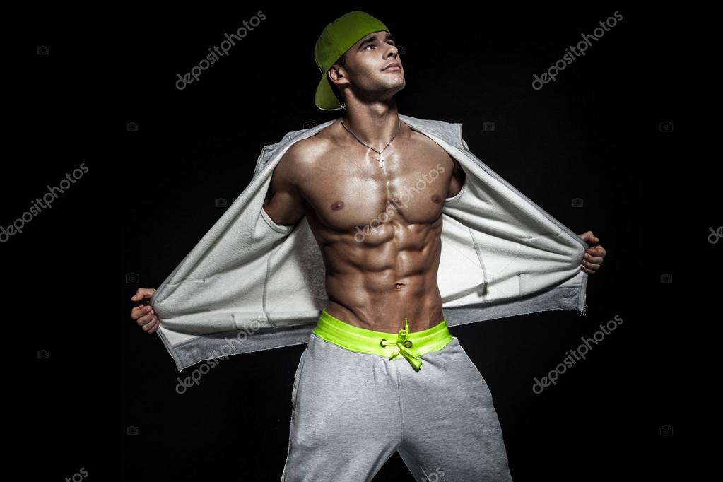 Athletic male model posing . Stock Photo by ©PawelSierak 98507038