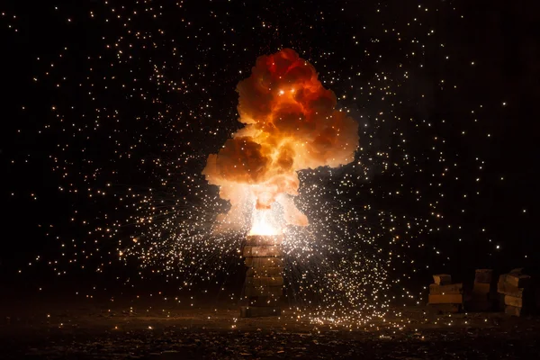 Realistic fiery explosion busting over a black background — Stock Photo, Image