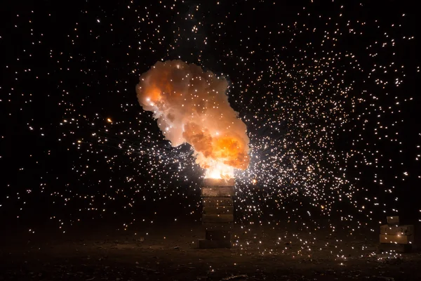 Realistic fiery explosion busting over a black background — Stock Photo, Image