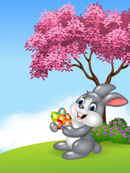 Conejo de Pascua sosteniendo huevos de Pascua en la selva — Vector de stock